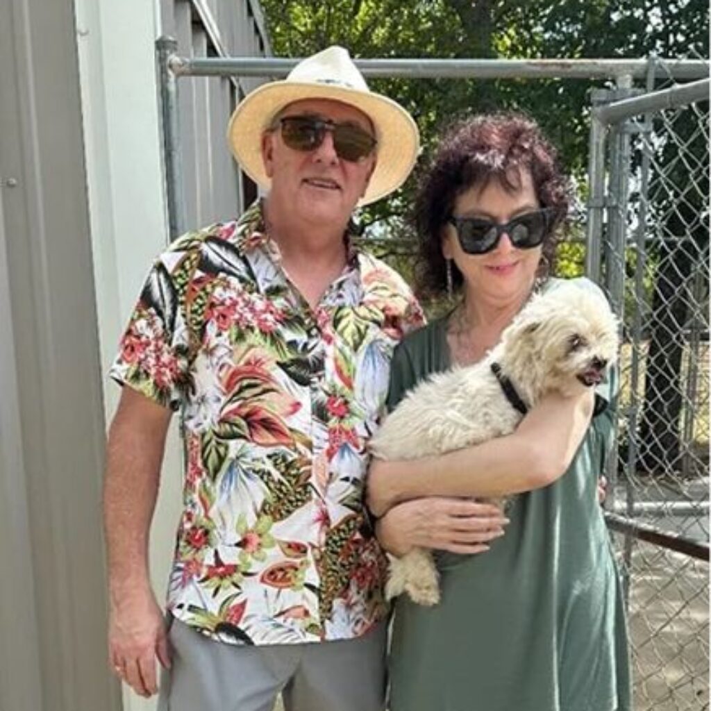 A man, woman and their dog