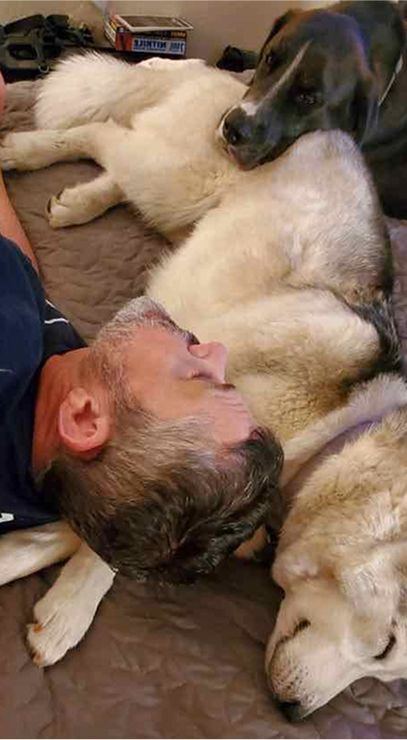 A sleeping man and dog